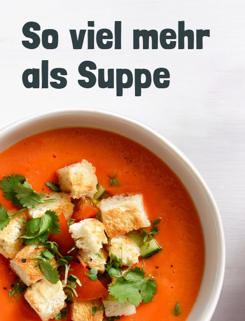 Eine Schüsseln voll mit Tomaten Suppe und croutons